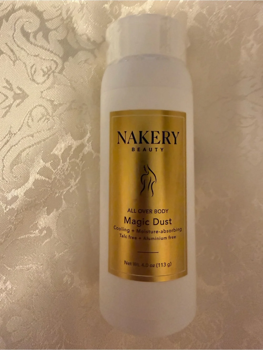 Nakery Beauty Magic Dust All-Over Body Powder — White with Gold Label